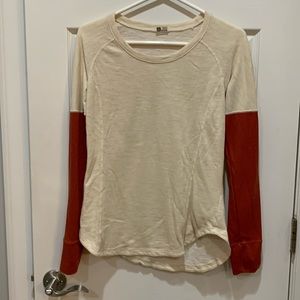Marmot top, cream body, dark orange sleeves, medium